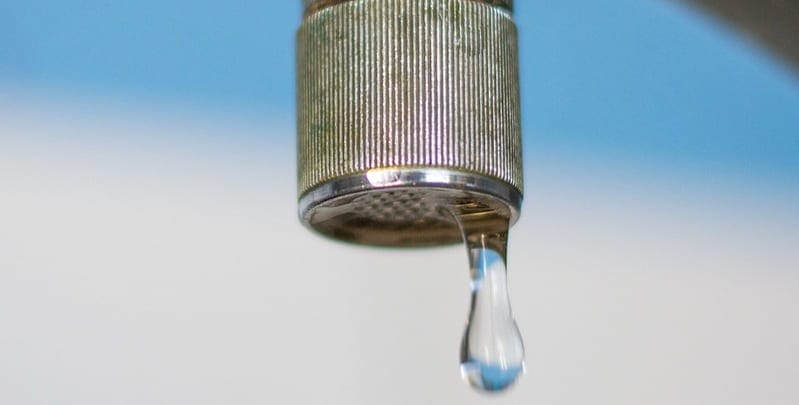 close up of a dripping tap