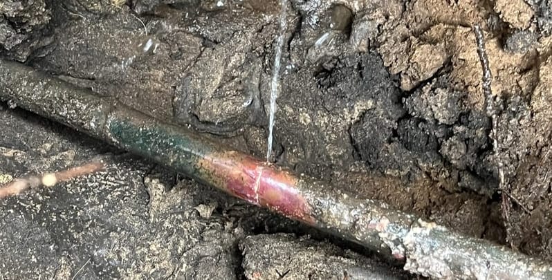 Underground pipe that has sprung a leak. 