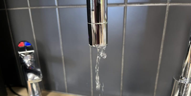 leaking tap in the middle of a drip